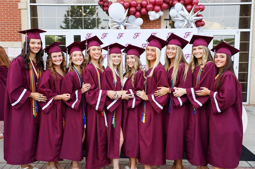 Graduates wearing maroon robes